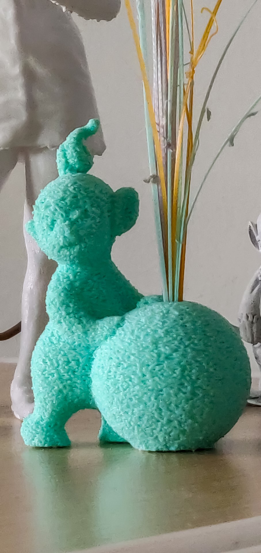 I converted this Teletubby model I found online to function as a vase for the little sticks of PLA the Ender 3 would create at the start of each job to clear out the nozzle and get it flowing well. I also played with the slicer tools to create the fuzzy effect